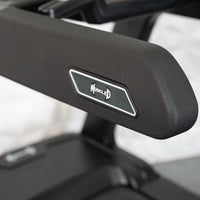 Thumbnail for Close-up of a black treadmill arm with a white and gray 
