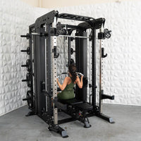 Thumbnail for Woman doing lat pulldowns on a black multi-station home gym with weight plates.