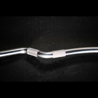 Thumbnail for Close-up of a silver, hard chrome curl bar with textured grip sections against a dark background.