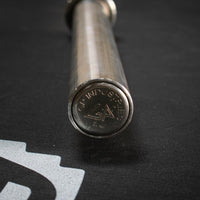 Thumbnail for Close-up of a stainless steel Olympic bar end cap with 