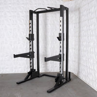 Thumbnail for Black half rack with adjustable safety bars and pull-up bar.