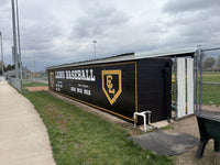 Thumbnail for Black dugout wrap with gold Lions Baseball lettering, a CL logo and state champion years on a baseball field