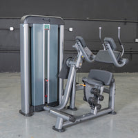 Thumbnail for Gray commercial-grade ab crunch machine with black padded seat and backrests.