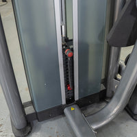 Thumbnail for Close-up of a weight stack with a red selector pin on a commercial-grade ab crunch machine.