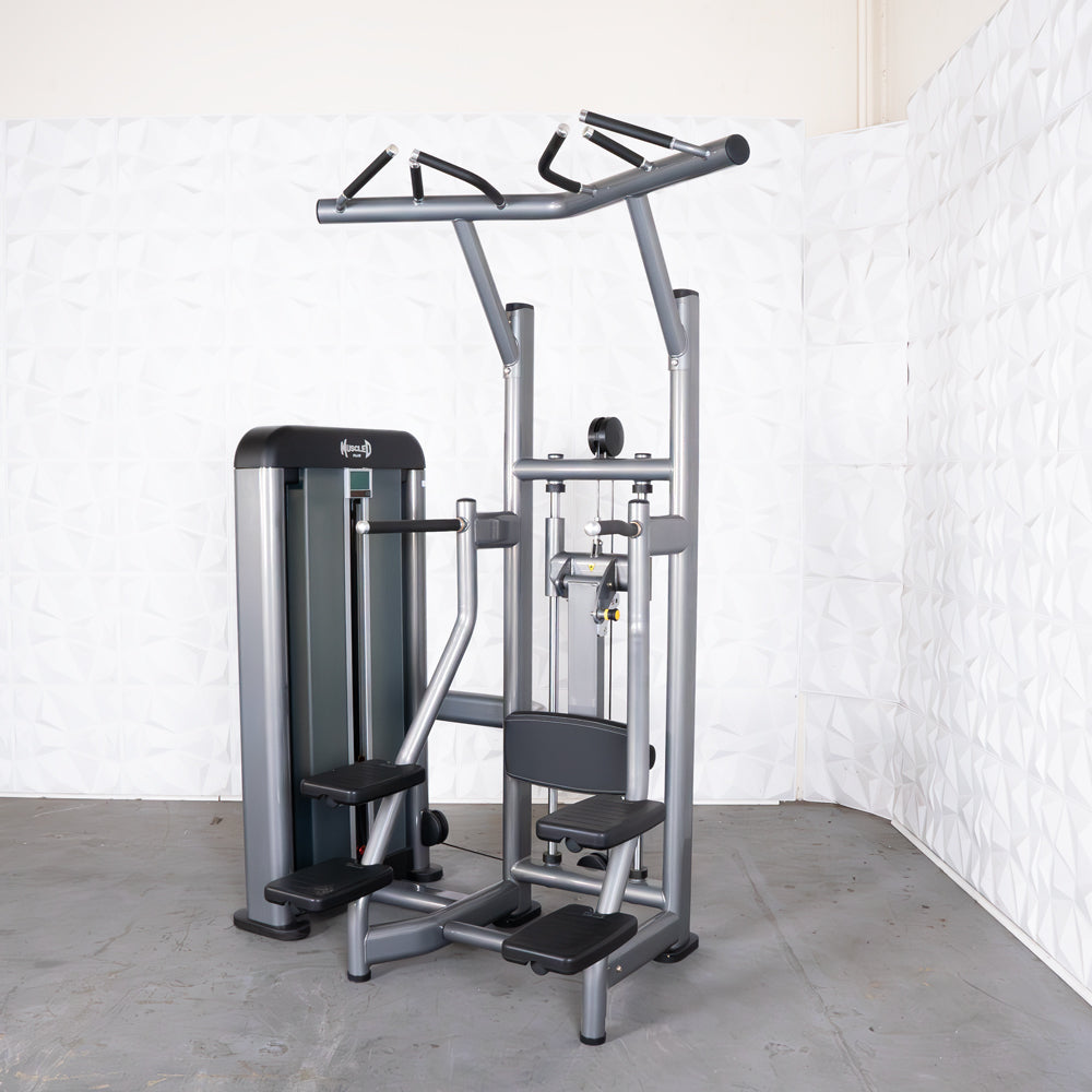 Gray commercial assisted chin/dip machine with adjustable seat and pin selectorized weight stack.