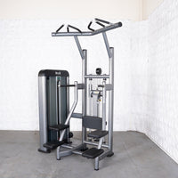 Thumbnail for Gray commercial assisted chin/dip machine with adjustable seat and pin selectorized weight stack.
