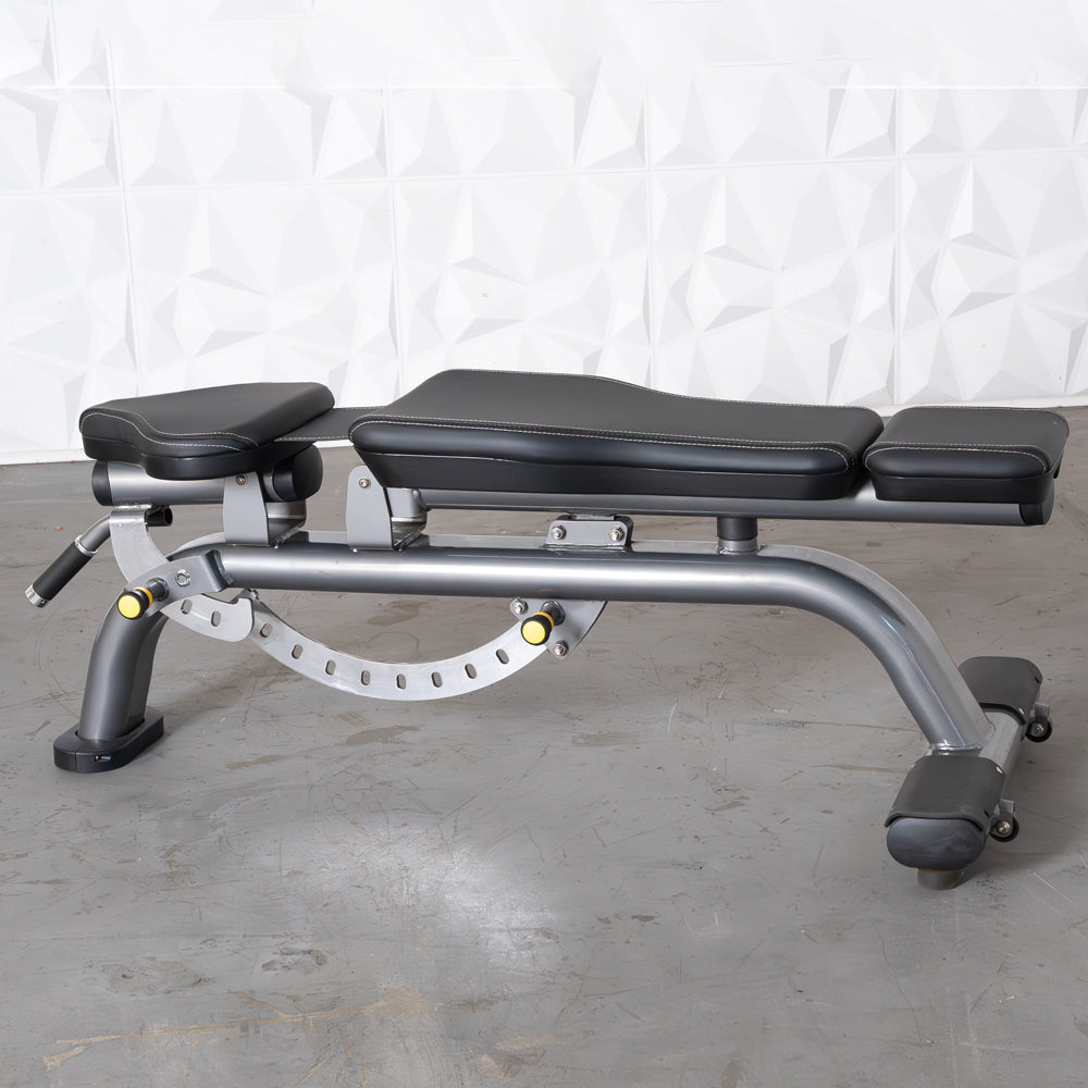 Gray adjustable weight bench with black padded seats and yellow adjustment knobs.