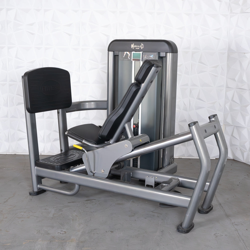 Gray leg press and calf raise machine with black padded seat and backrest.