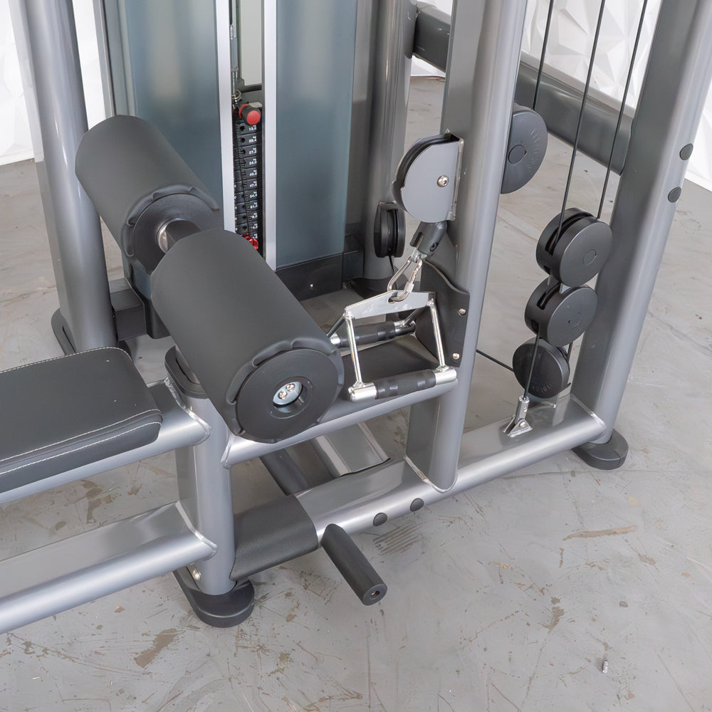 Close-up of a gray lat/low row machine with black padded rollers, a seat, and a weight stack.