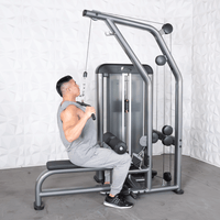 Thumbnail for Man in gray tank top and sweatpants using a gray lat pulldown machine with a black seat and leg pads.