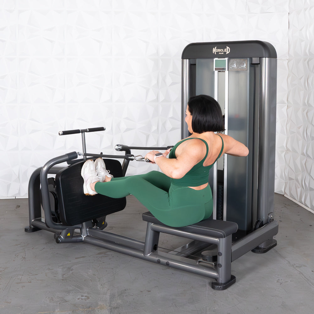Woman in green using a Muscle D Fitness long pull row machine.