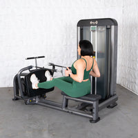 Thumbnail for Woman in green using an Elite Plus Long Pull Row machine.