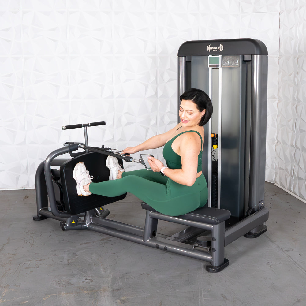 Woman in green activewear using a Muscle D Fitness Elite Plus Long Pull Row machine.