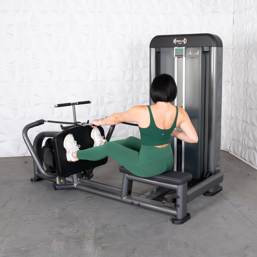 Woman in green activewear using a Muscle D Fitness long pull row machine.