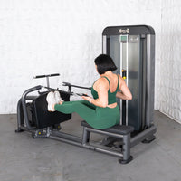 Thumbnail for Woman in green activewear using a Muscle D Fitness Elite Plus Long Pull Row machine.