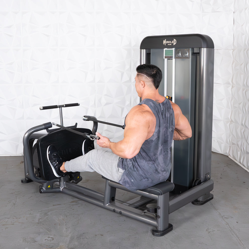 Man using a gray iso-lateral long pull row machine with black accents.