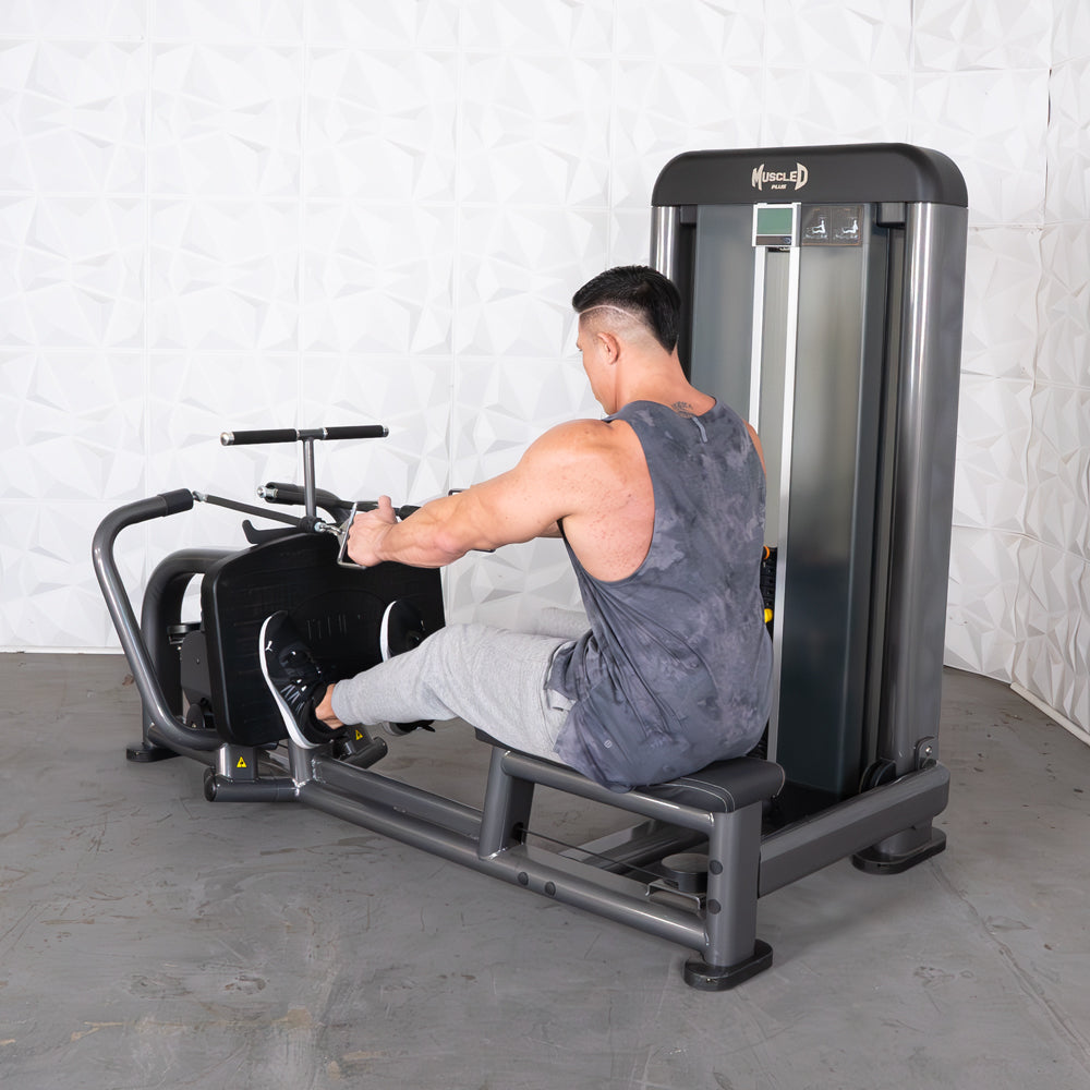 Man in gray tank top using a Muscle D Fitness long pull row machine.