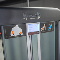 Thumbnail for Close-up of a Muscle D Plus biceps curl machine with a digital display showing time, intervals, and reps.