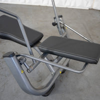 Thumbnail for Close-up of an ab roller machine with gray frame and black padded seats.