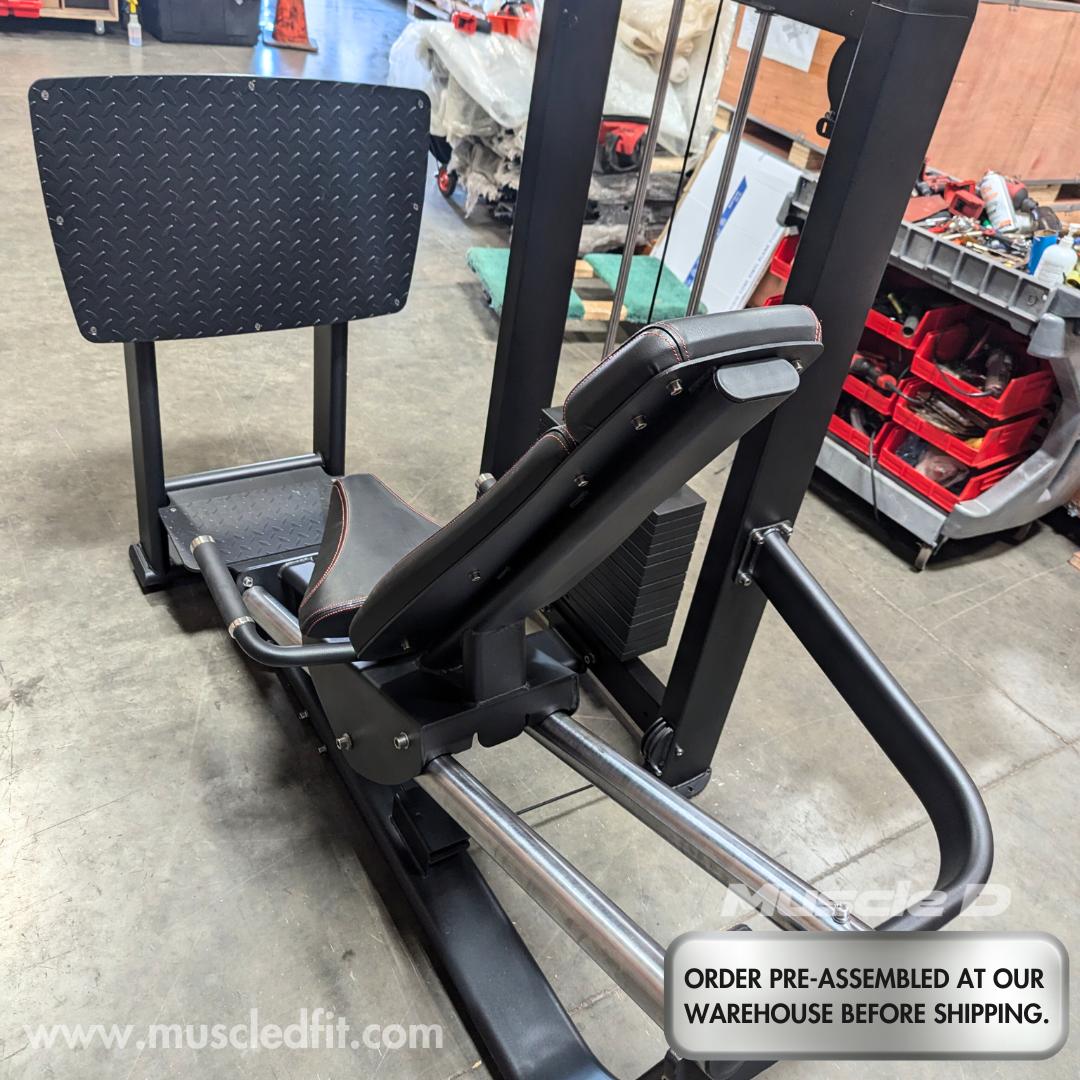 Black selectorized leg press machine with a diamond plate foot platform and adjustable seat.