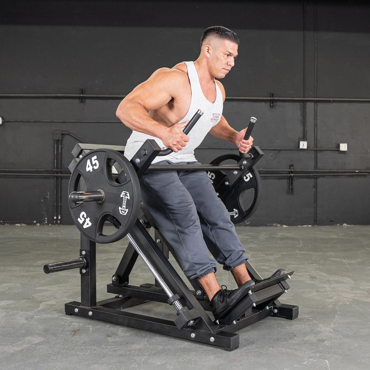 Man using a linear bearing row machine with 45lb plates, gripping multi-grip handles.
