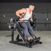 Thumbnail for Man using a linear bearing row machine with multi-grip handles and adjustable pad, loaded with 45lb plates.