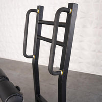 Thumbnail for Close-up of the black metal frame and handles of the Excel Standing Hip Thrust machine.