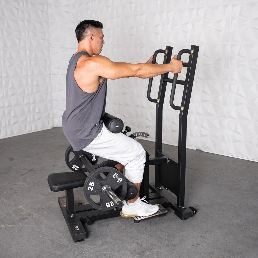 Man using a black plate-loaded hip thrust machine with 25lb weights.