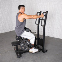 Thumbnail for Man using a black plate-loaded hip thrust machine with 25lb weights.