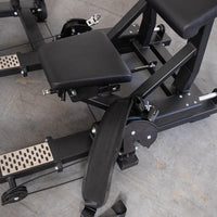 Thumbnail for Close-up of a black selectorized hip thrust glute machine with padded seats and a wide strap.