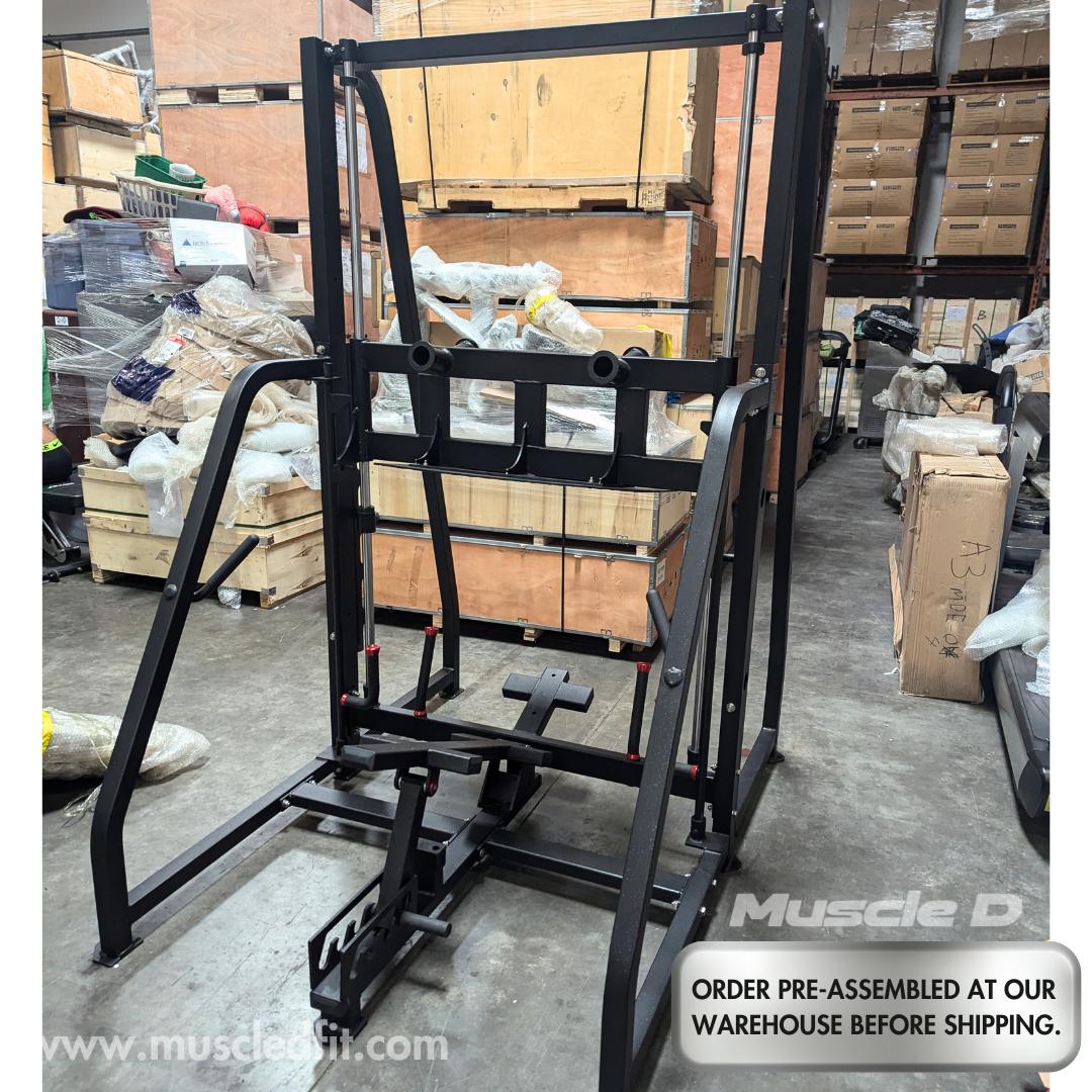 Black vertical leg press machine in a warehouse setting.