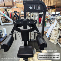 Thumbnail for Black selectorized delt raise machine with padded seat and armrests in a warehouse.