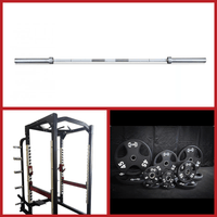 Thumbnail for Power cage, barbell, and a set of black weight plates.