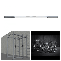Thumbnail for Barbell, power rack with J-hooks, and a set of black weight plates.