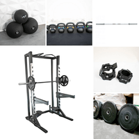 Thumbnail for A half rack with barbell, weight plates, kettlebells, medicine balls, and barbell clamps.