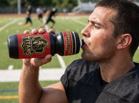 Thumbnail for Athlete drinking from a black water bottle with a red and gold 