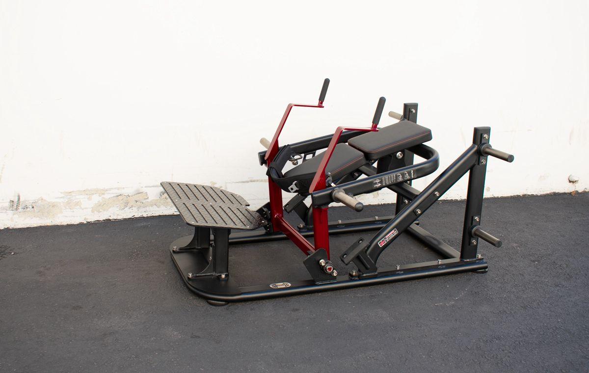 Black and red plate-loaded hip thruster machine with a padded seat and foot platform.