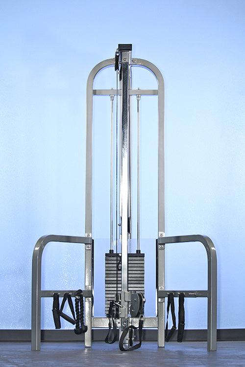 Gray vertical adjustable pulley combo machine with weight stacks and black handles.