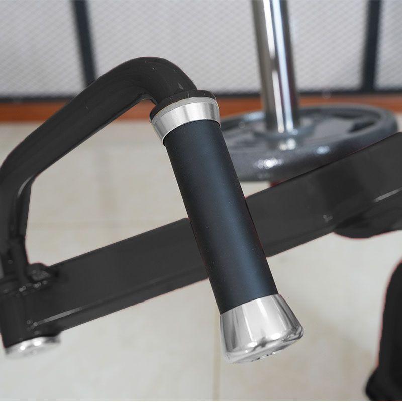 Close-up of a black gym machine handle with silver accents.