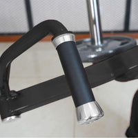 Thumbnail for Close-up of a black gym machine handle with silver accents.