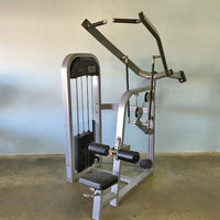 Thumbnail for Silver and black lat pulldown machine with a weight stack, seat, and leg pads.