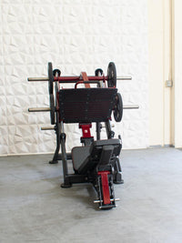 Thumbnail for Red and black plate-loaded leg press machine with an adjustable back pad.