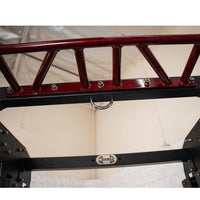 Thumbnail for Close-up of a red pull-up bar with a D-ring attachment on a black fitness rack.