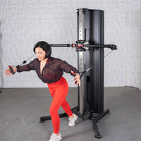 Thumbnail for Woman in red leggings using a black dual adjustable functional trainer.