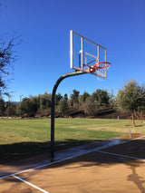 Gooseneck basketball hoop with clear backboard and orange rim on an outdoor court.