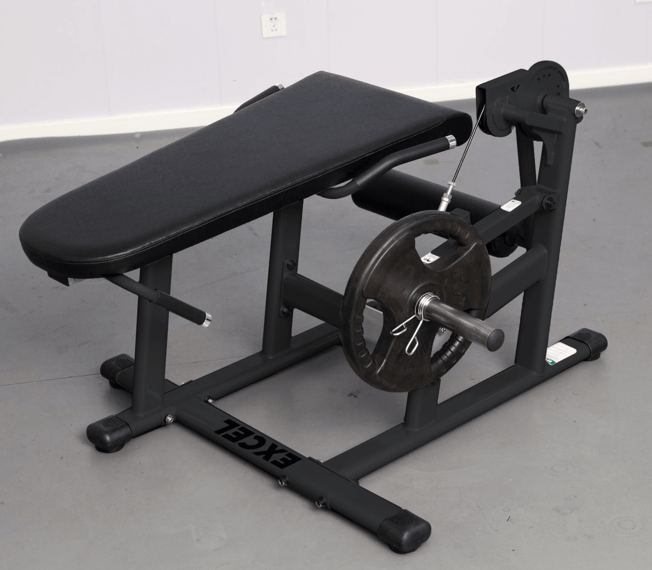 Black plate-loaded leg extension/curl machine with a padded bench and a single weight plate.