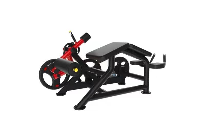 Black and red prone leg curl machine with a padded bench and weight plate.