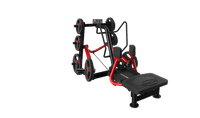 Thumbnail for Black and red standing abductor machine with weight plates on a dark green background.