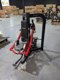 Thumbnail for Black and red Sweet Lateral Raise machine with padded seat and armrests in a warehouse.