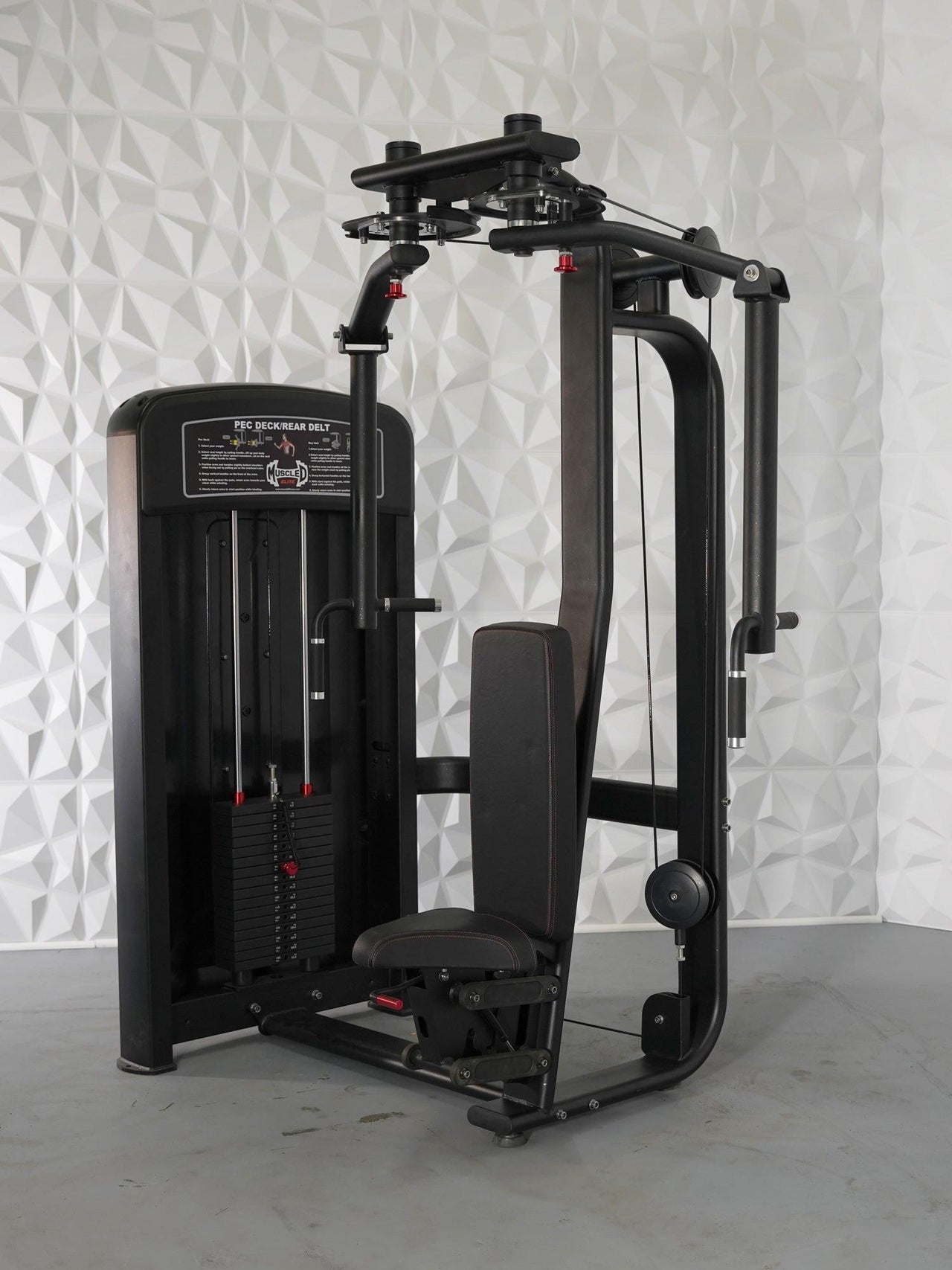 Black commercial pec deck/rear delt machine with weight stack, adjustable seat, and red accents.